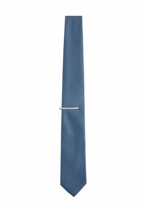 Blue textured necktie with a small woven pattern and a silver metal tie clip positioned near the center.
