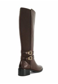 Brown leather and textile knee-high boot with two gold buckle accents and a block heel. Smooth texture and sleek design.