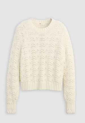 Pull en tricot de couleur crème avec un motif ajouré texturé et complexe, et des poignets et un ourlet côtelés.