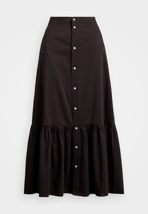 Sorte bomuldsnederdel med en tætsiddende talje, knaplukning foran og lagdelt flæse-kant. Glat tekstur og klassisk design.