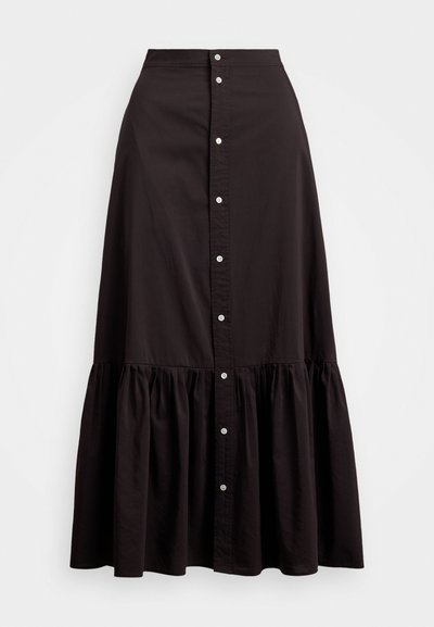Black cotton skirt with a fitted waist, button front closure, and tiered ruffle hem. Smooth texture and classic design.