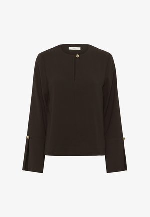 Sötétbarna, hosszú ujjú blúz kerek nyakkivágással, arany gombbal a gallérnál és arany gombokkal a mandzsettaszabásokon.