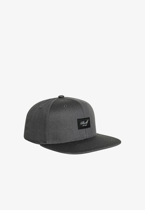 Dark gray flat-brim baseball cap with black rectangular patch on front displaying white cursive text.