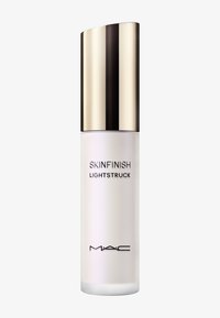 MAC Skinfinish Lightstruck, flacon en verre givré avec un capuchon noir et doré brillant, arborant un texte noir audacieux à l'avant.
