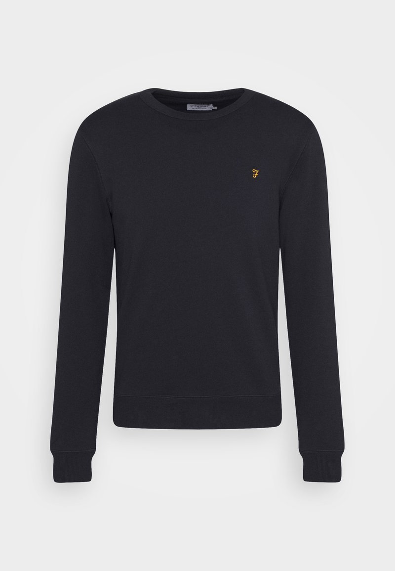 Sudadera negra de algodón, con un cuello redondo, mangas largas y un pequeño logotipo amarillo en el pecho. Textura suave con puños acanalados.