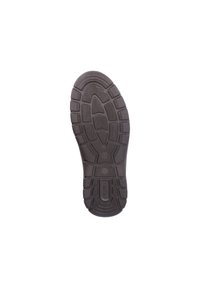 Semelle de chaussure en caoutchouc noir présentant un motif de semelle texturé avec des rainures et des sections surélevées pour la traction et la stabilité.