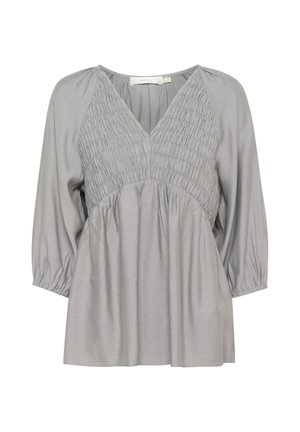 Gray blouse with a V-neck, smocked detailing on the chest, three-quarter sleeves, and a loose fit hem. Smooth fabric with slight sheen.