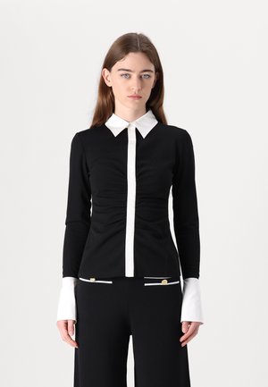 Pikkade varrukatega topp - black
