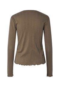 Maglietta a maniche lunghe di colore marrone con un motivo testurizzato, scollo rotondo e orlo arricciato sui polsini e sul fondo. Finitura del tessuto liscia.