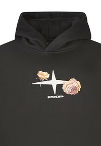Felpa nera con un design frontale che presenta una stella bianca e due grafiche floreali in colori tenui; il tessuto appare liscio e ha una vestibilità casual.