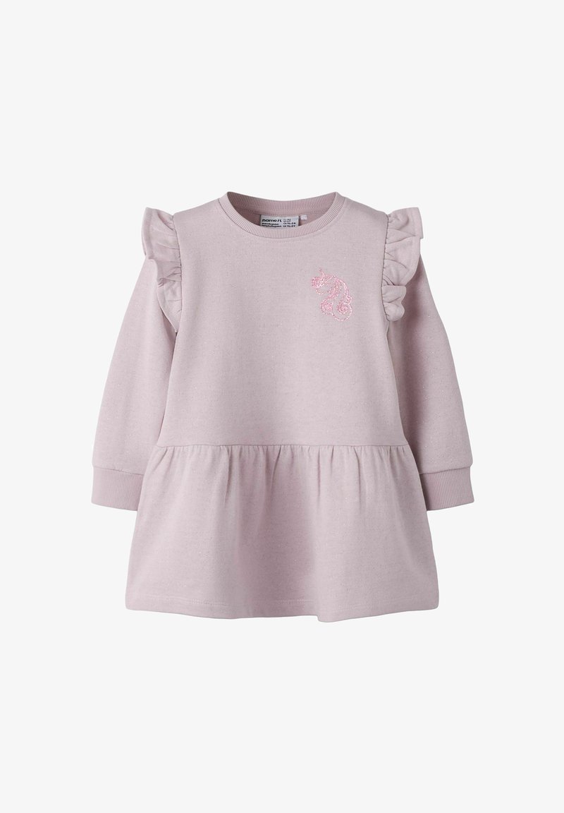 Rožinė medvilninė suknelė su volanais ant rankovių, platėjančia sijono dalimi ir blizgiu vienaragio išsiuvinėjimu ant krūtinės. Minkšta tekstūra, apvali kaklo linija.