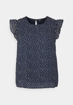 Σκούρο μπλε μπλούζα με διάσπαρτο λευκό γεωμετρικό σχέδιο, κοντά ριχτά μανίκια και λεπτομέρεια με σχισμή στην πλάτη. Ελαφρύ, λείο ύφασμα.