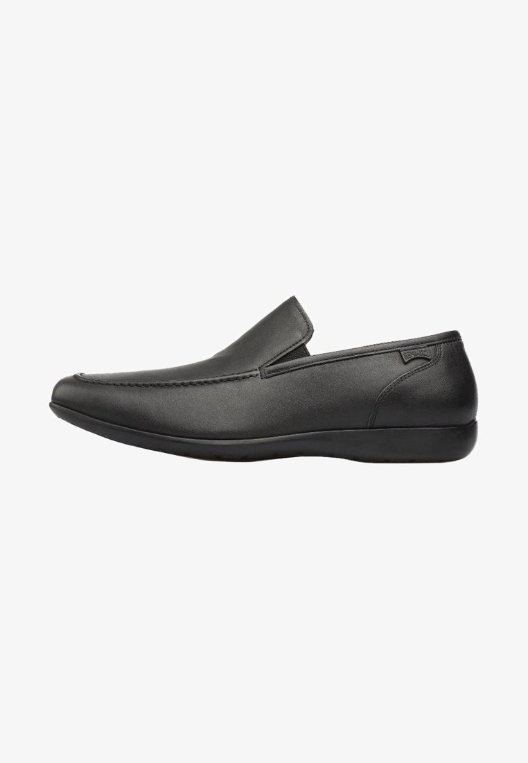 Black slip-on shoes made of smooth leather with a rounded toe. Features a soft sole and minimalistic design with side elastic accents.