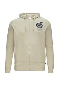 Beige zip-up hoodie gemaakt van zacht materiaal. Heeft een grafische print aan de voorkant, twee grote zakken en een verstelbare capuchon met ribbels aan de mouwen.