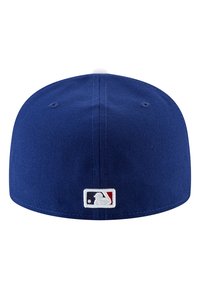 Blue baseball cap made of textured fabric, featuring a flat brim and a white button on top. MLB logo patch on the back.