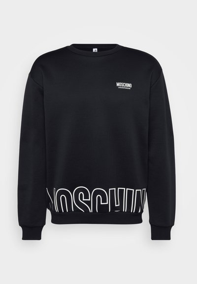 Black sweatshirt made of cotton blend with crew neck. Features white "MOSCHINO" logo at the chest and large lettering at the hem.