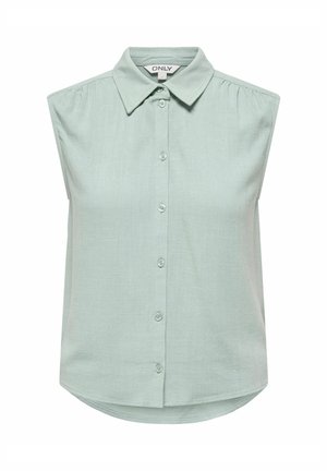 Chemise sans manches à boutons de couleur vert pastel clair, avec un col pointu et de légères fronces sur les épaules, étiquette de marque "ONLY" à l'intérieur du col.