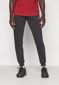 Puma SWEATPANTS  - Donji dijelovi trenirke - puma black