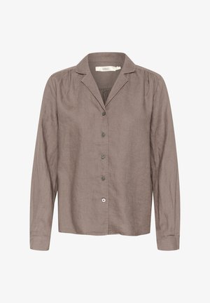 Brun linned skjorte med lange ærmer, kraveudskæring, knaplukning foran og subtile samlingdetaljer ved skuldrene.