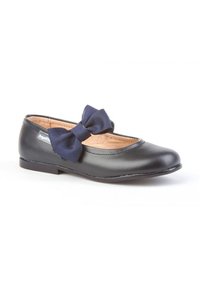 Zapato Mary Jane negro con un lazo azul marino en la correa y un forro interior color beige claro, diseñado para niñas.