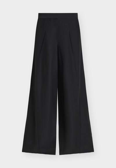 Pantalon noir à jambes larges, taille haute et plis à l'avant, présenté à plat sur un fond clair.