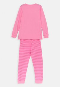 Pink long-sleeve top with round neck and matching striped pajama pants, featuring alternating solid and striped patterns in similar pink tones.