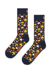 Calcetines azul marino con un patrón de estrellas multicolores en rojo, amarillo y blanco, con una parte superior acanalada y "HAPPY" en naranja en la puntera.