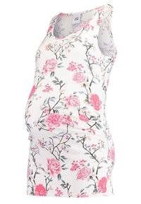 Top de maternidad floral en tela ligera, con flores rosas y follaje sobre un fondo blanco, con un dobladillo redondeado y diseño sin mangas.