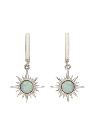 Silver hoop earrings with starburst charms featuring round iridescent opal stones in the center.