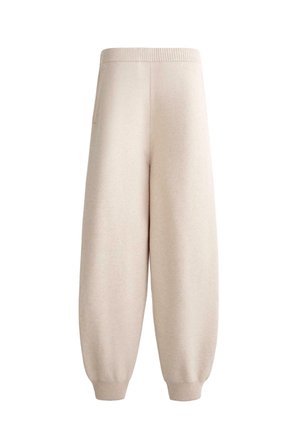 Beige gebreide joggerbroeken met wijde pijpen, voorzien van een elastische tailleband en boorden, met een comfortabele pasvorm en zijzak.