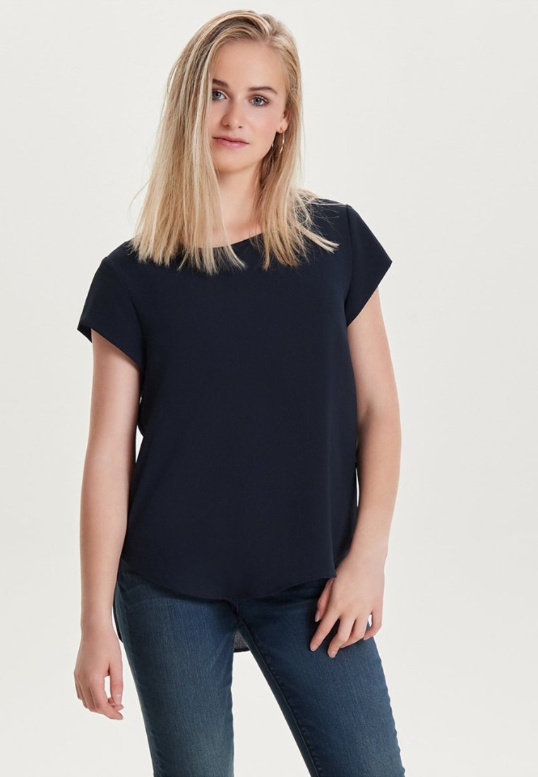 Navy blue short-sleeve top with a round neckline, made of lightweight fabric. Features a slightly curved hem for a relaxed fit.