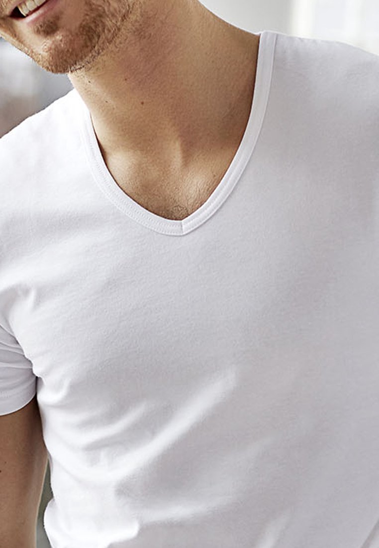 White cotton v-neck t-shirt with short sleeves, featuring a smooth texture and a close-fit design.
