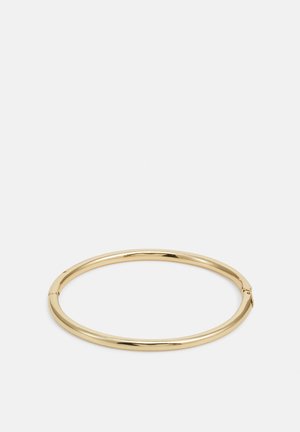 Gold bangle bracelet with a smooth, shiny surface, featuring a round shape and a subtle clasp detail.