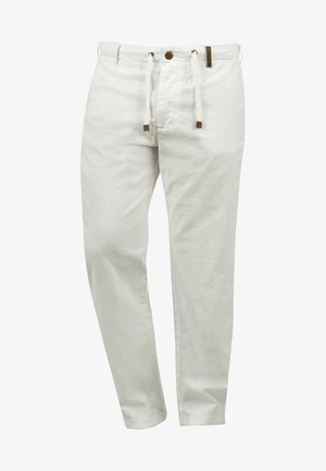 Lightweight white linen pants with a drawstring waist, button fastening, and brown leather accents, featuring a relaxed fit and smooth texture.