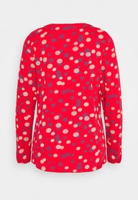 Rotes Langarm-Oberteil mit mehrfarbigem Punktmuster in Creme und Navy. Mit Rundhalsausschnitt und lässiger Passform. Aus weichem Baumwollmaterial.