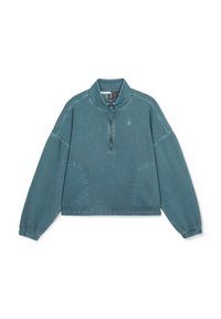 Teal kvart-zip pullover lavet af blødt stof med elastiske ærmer og sidelommer. Har syede sømme og et lille logo på brystet.