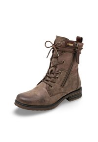 Bottines marron en matériau texturé, avec un laçage, une fermeture éclair sur le côté et un petit talon empilé pour plus de stabilité.