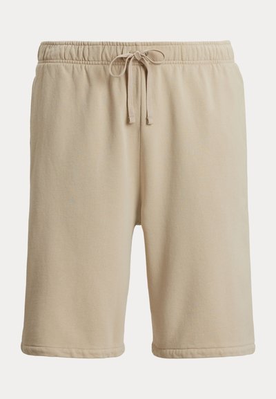 Beige bomullsshorts med elastisk midje og snøring, med glatt tekstur og oppbrettede kanter. Casual og komfortabel design.