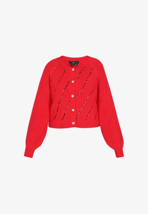 Red knitted cardigan featuring a cropped design, textured cable patterns, shiny embellishments, and six white buttons down the front.