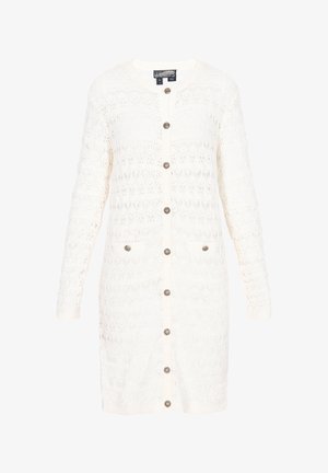 Bela kvačkana kardigana z dolgimi rokavi, sprednjimi gumbi in dvema žepoma. Ima odprto zasnovo in okroglo ovratnico.