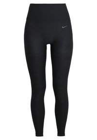 Czarne legginsy z wysokim stanem o gładkiej fakturze i prążkowanych akcentach na dolnej części, z delikatnym logo Nike z przodu.