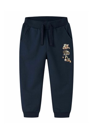 Pantalon de jogging bleu marine pour enfants avec taille élastique, cordon, poches latérales et véhicules de construction imprimés sur la jambe droite.