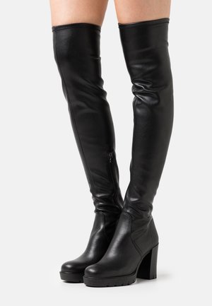 Black leather over-the-knee boots with a chunky heel. The design features a side zipper and smooth texture with stitched detailing at the top.