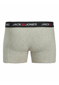 Pilkos medvilnės bokso šortai su juodu juosmeniu, ant kurio yra baltos ir raudonos „JACK & JONES“ ženklai. Lygus paviršius su minimaliais siūlių detalėmis.