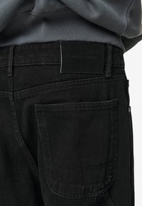 Pegador DAULE BAGGY - Baggy Jeans - deep black