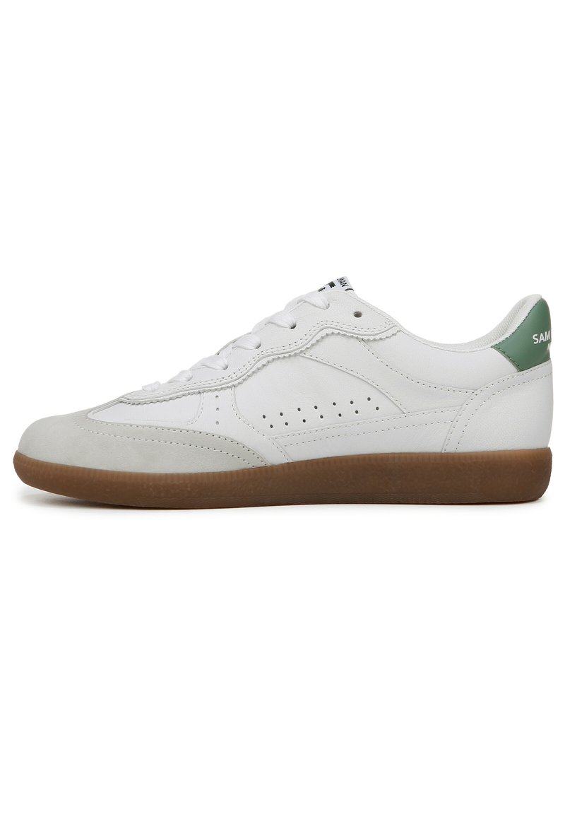White leather sneaker with a smooth finish, light green heel accent, perforated sides, and a brown rubber sole.