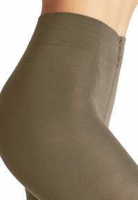 Leggings verde oliva con una superficie liscia e a coste e alta vita, progettati per comfort e flessibilità.