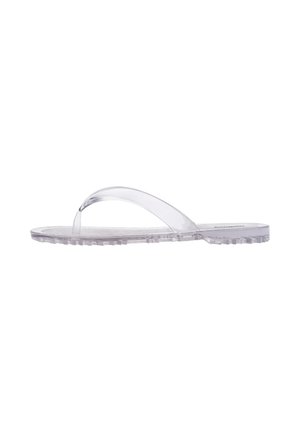 Sandalia de flip-flop de plástico transparente con una tira delgada, suela texturizada y suela plana. Diseñada para uso casual y comodidad ligera.