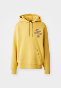 Gelbe Baumwoll-Hoodie mit Kängurutasche. Mit einem Grafikdruck auf der Brust und einer Kapuze mit Kordelzug. Gerippte Bündchen und Saum.