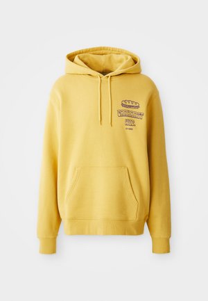 Yellow cotton hoodie with a kangaroo pocket. Features a graphic print on the chest and a drawstring hood. Ribbed cuffs and hem.